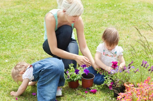 Professional gardeners working on a garden bed